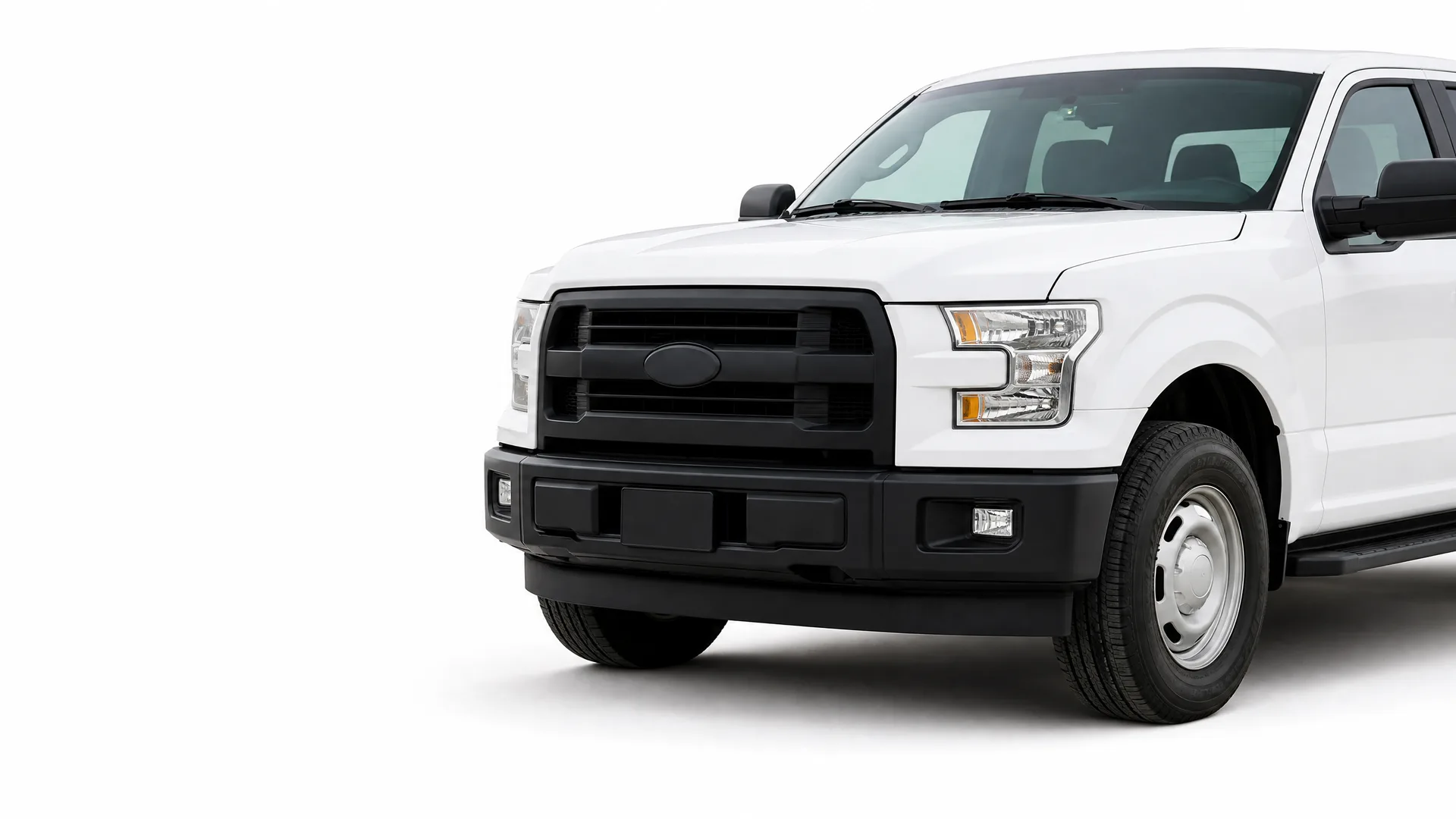 Front half of a white four-door pickup truck with a black grille, black bumper and steel wheels, photographed against a plain white background.