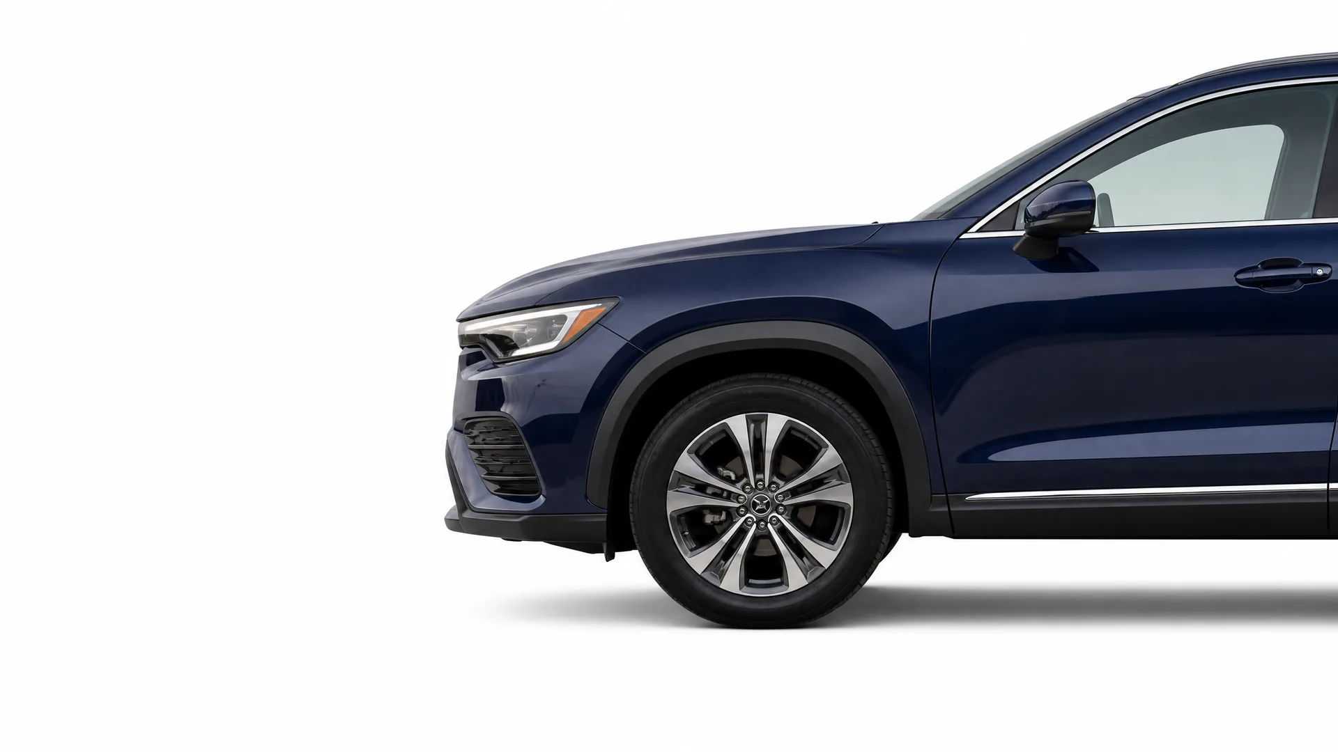 Partial side view of the front half of a dark blue SUV, showing the headlight, front wheel with alloy rim, and front door, against a plain white background.