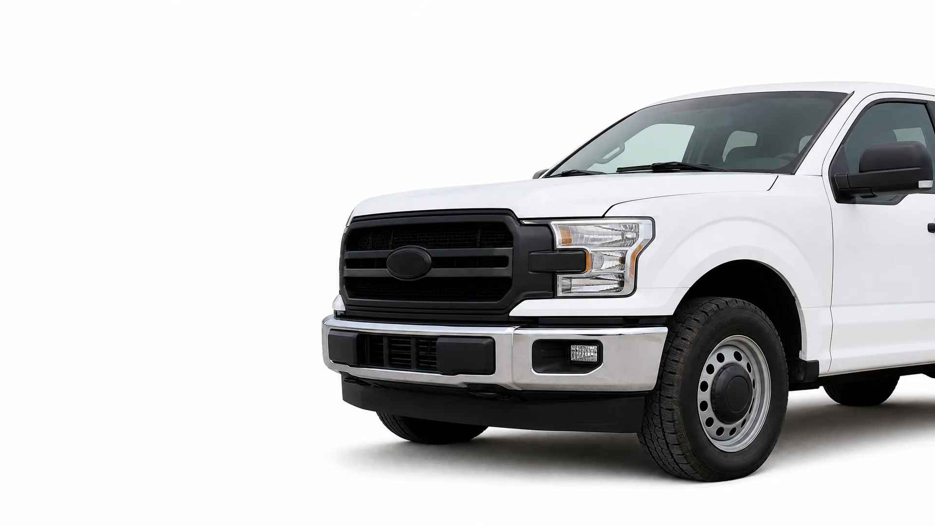 Front half of a white pickup truck with a black grille, chrome bumper and steel wheel, shown against a plain white background.