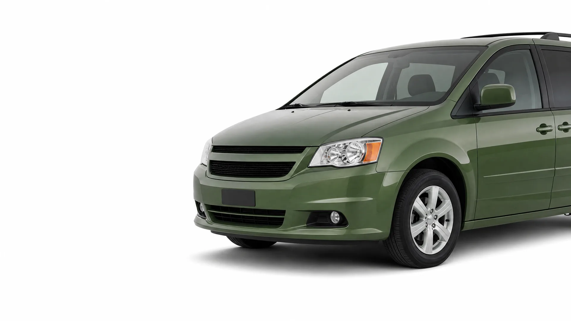 Front three-quarter view of a green minivan, partially cropped at the rear, photographed against a plain white background.