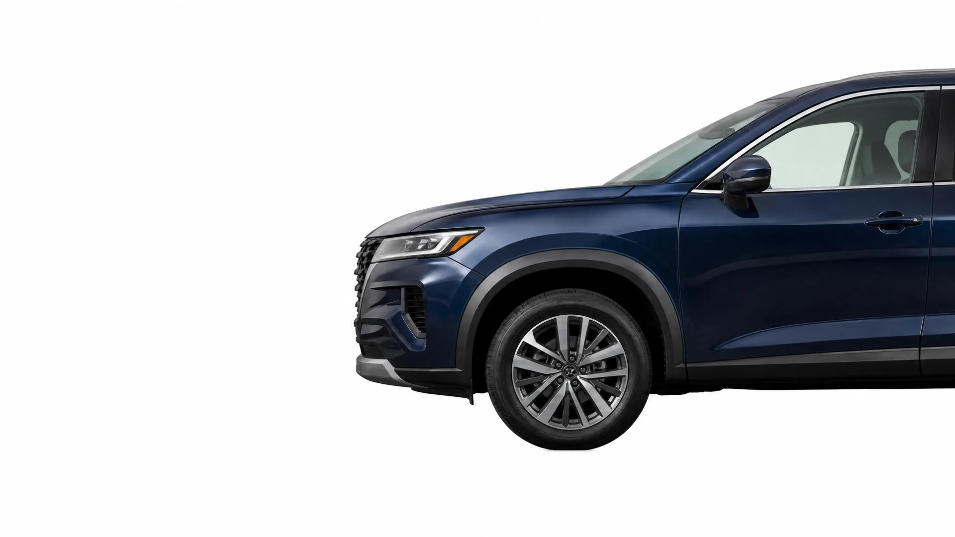 Front half of a dark blue SUV shown in side profile against a plain white background, with the rear portion cropped off.