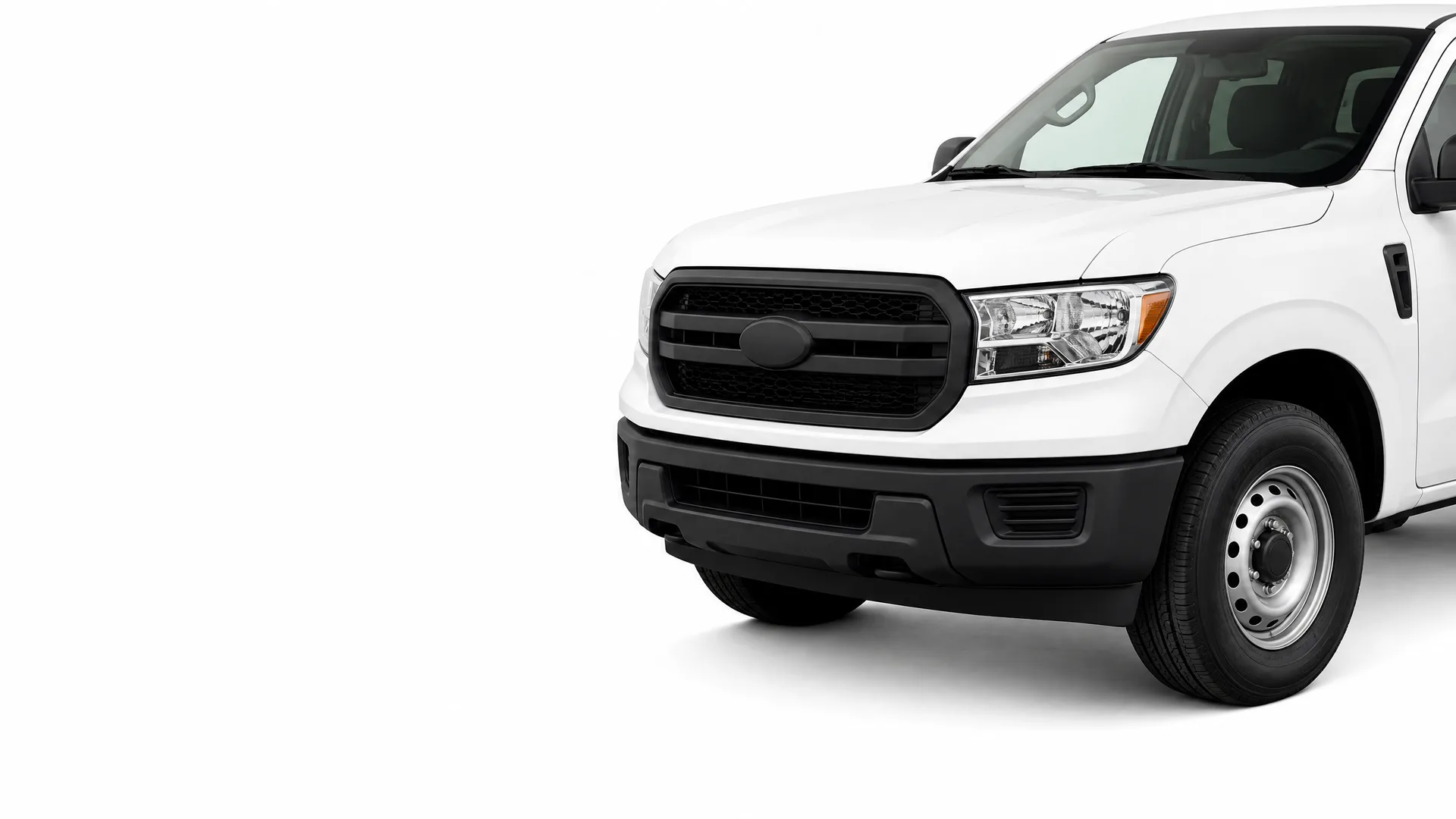 Front three-quarter view of a white pickup truck with a black grille, black bumper and steel wheels, shown against a plain white background.