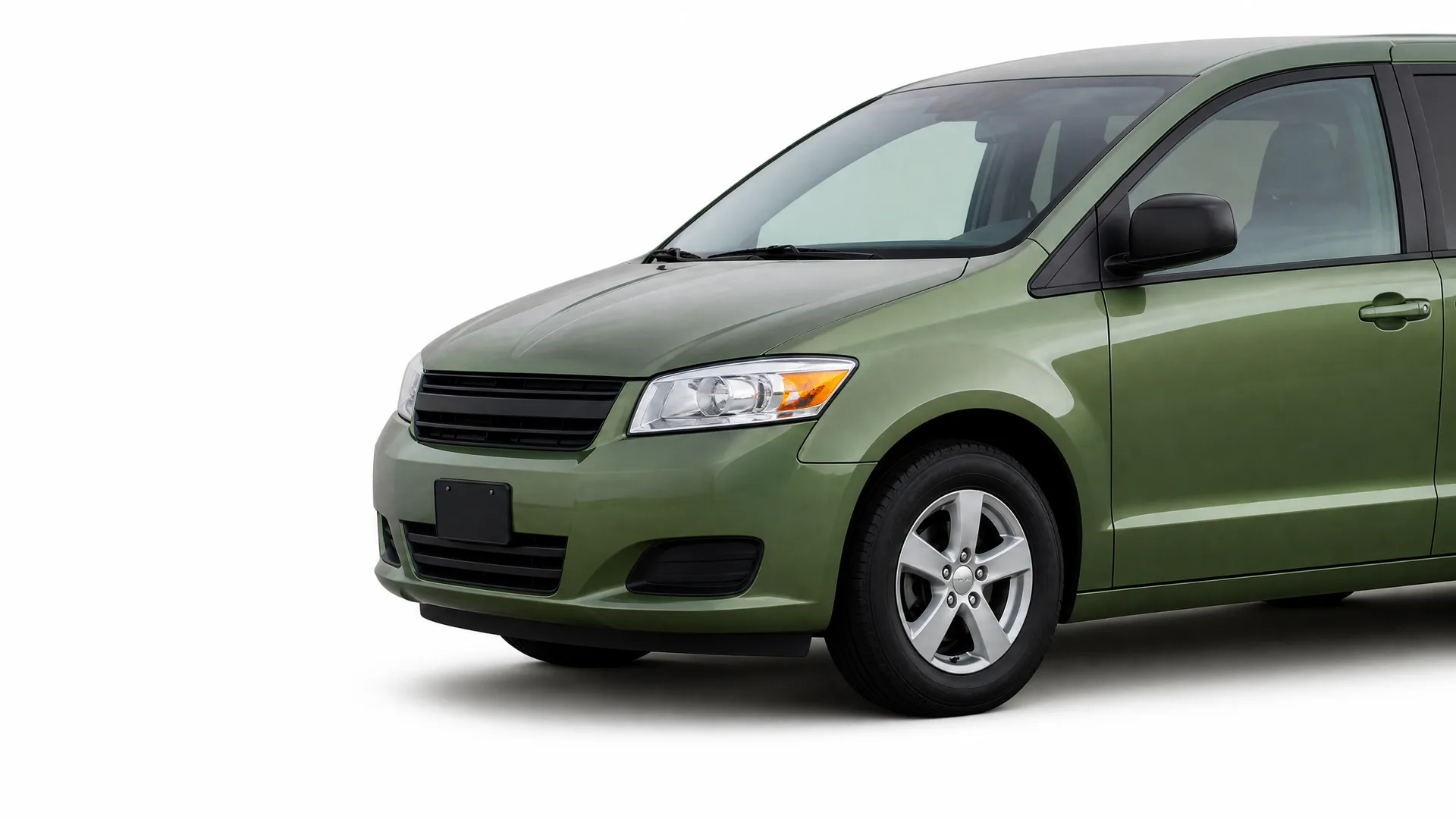 Front three-quarter view of a green minivan without license plate, photographed against a plain white background.