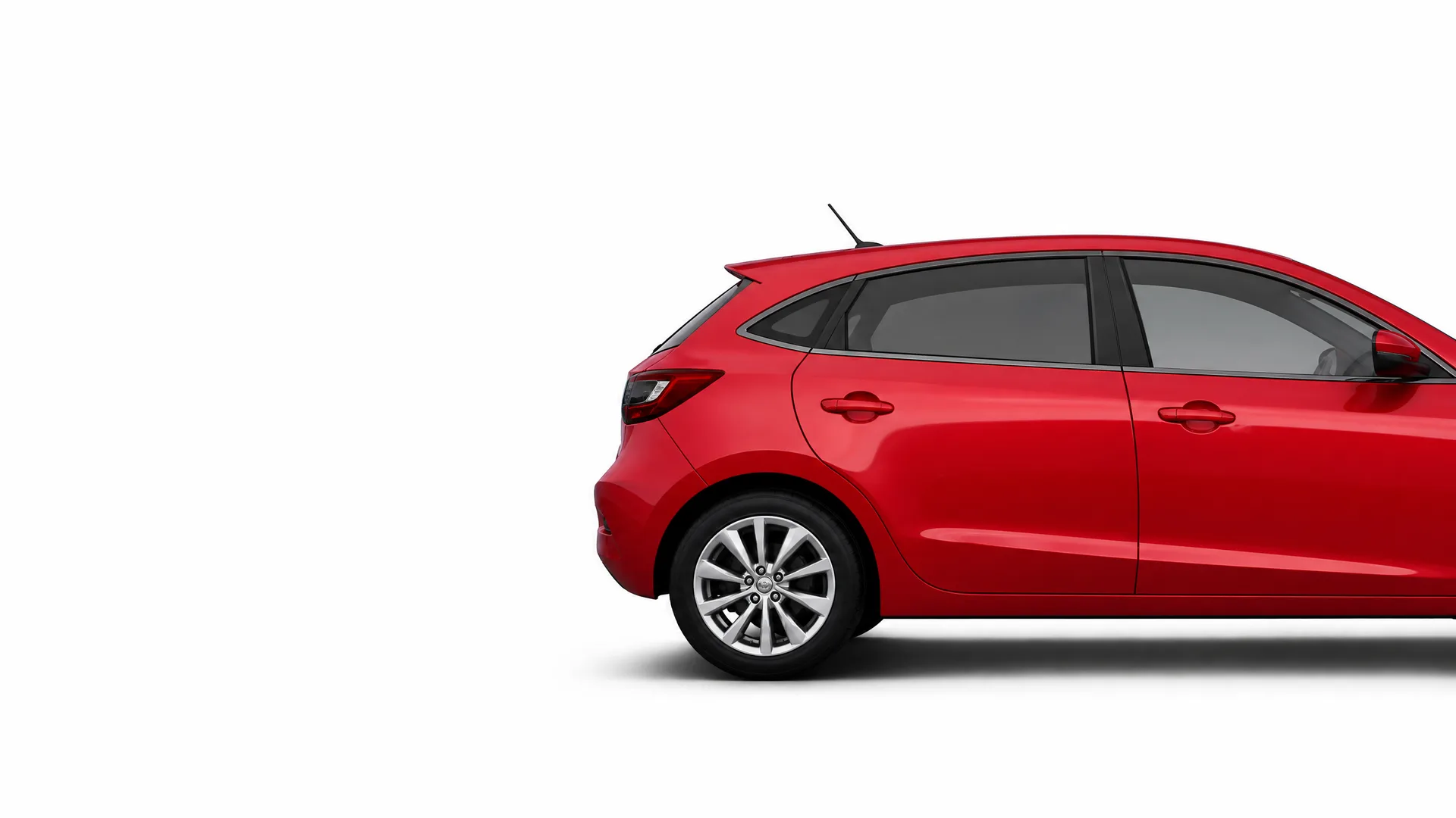 Rear half of a red five-door hatchback car shown in profile against a plain white background.