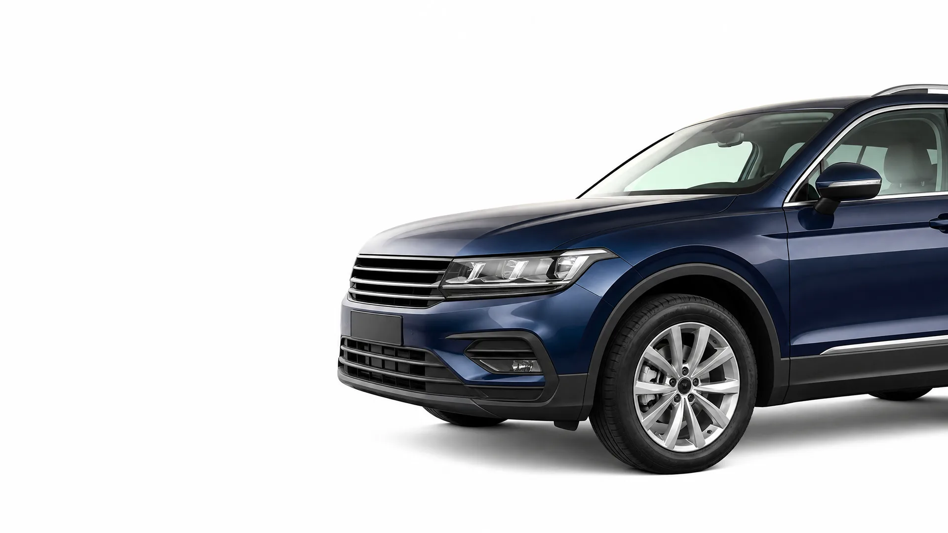 Front three-quarter view of a dark blue SUV, cropped at the rear, on a plain white background.