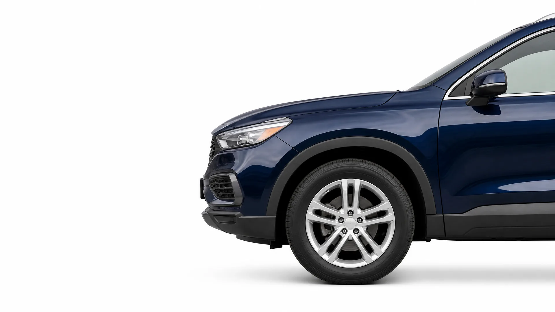 Front half of a dark blue SUV shown in profile against a plain white background, with the front wheel, headlight, mirror and front door visible.