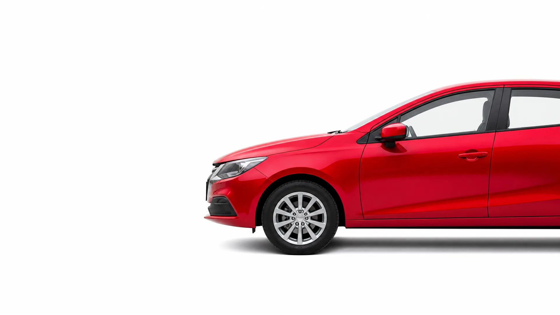 Front half of a red four-door car shown in side profile against a plain white background with a soft shadow beneath it.