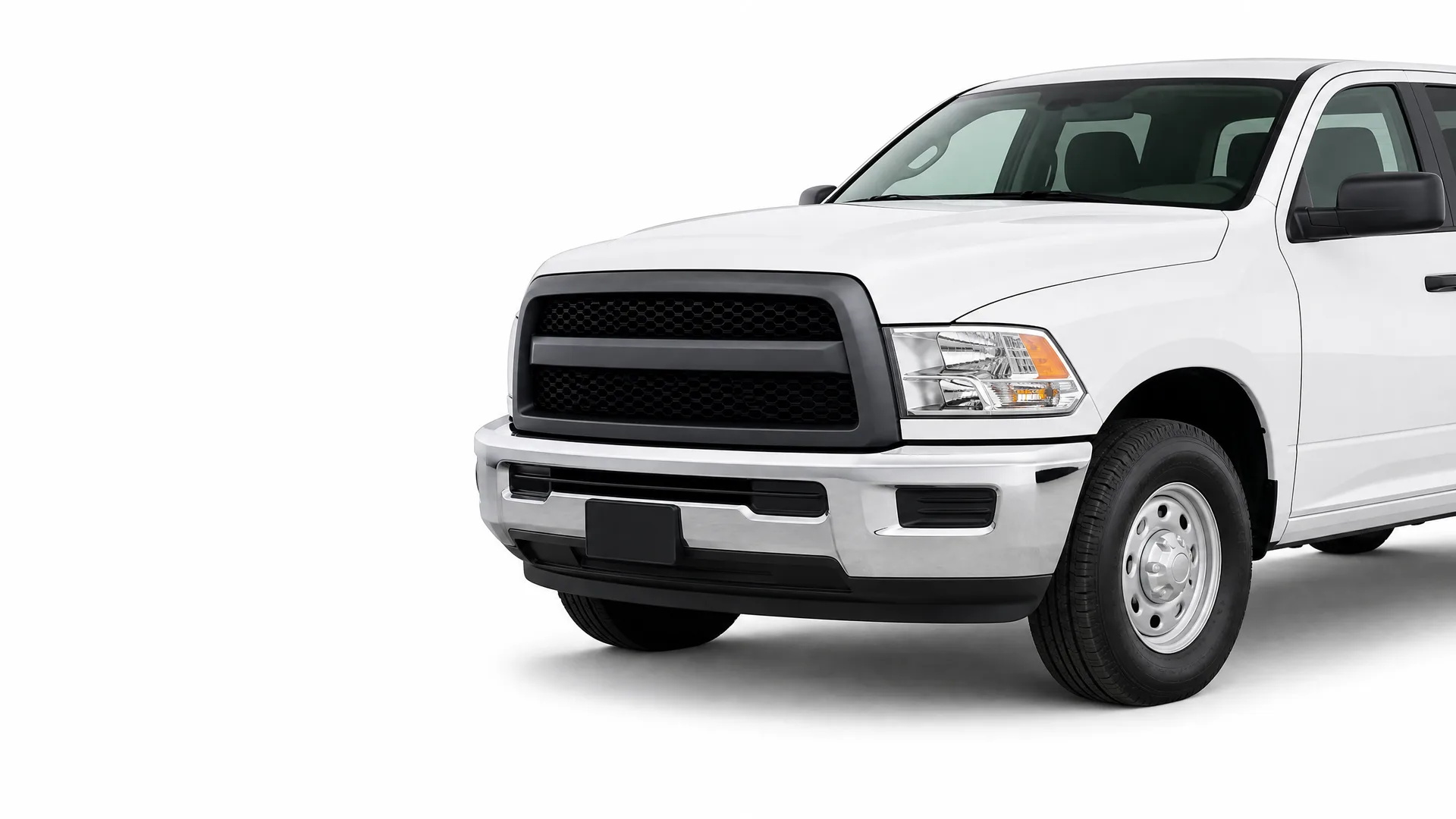 Front three-quarter view of a white crew-cab pickup truck with a black grille and blank license plate area, isolated on a white background.