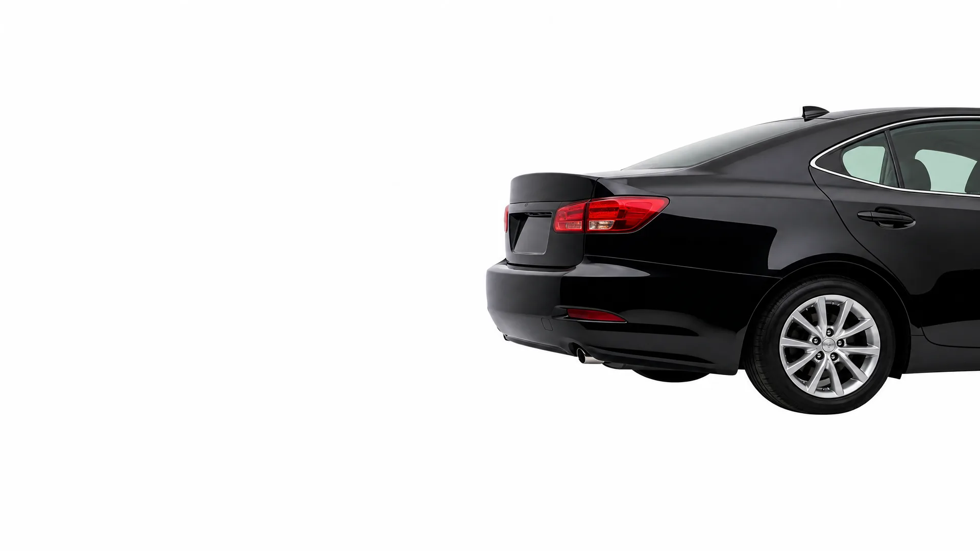 Rear three-quarter view of a black four-door sedan, partially cropped, against a plain white background.