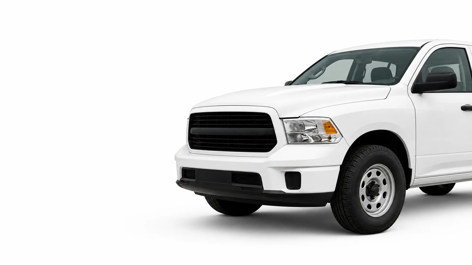 Front half of a white pickup truck with a black grille and steel wheel, shown against a plain white background with a soft shadow.
