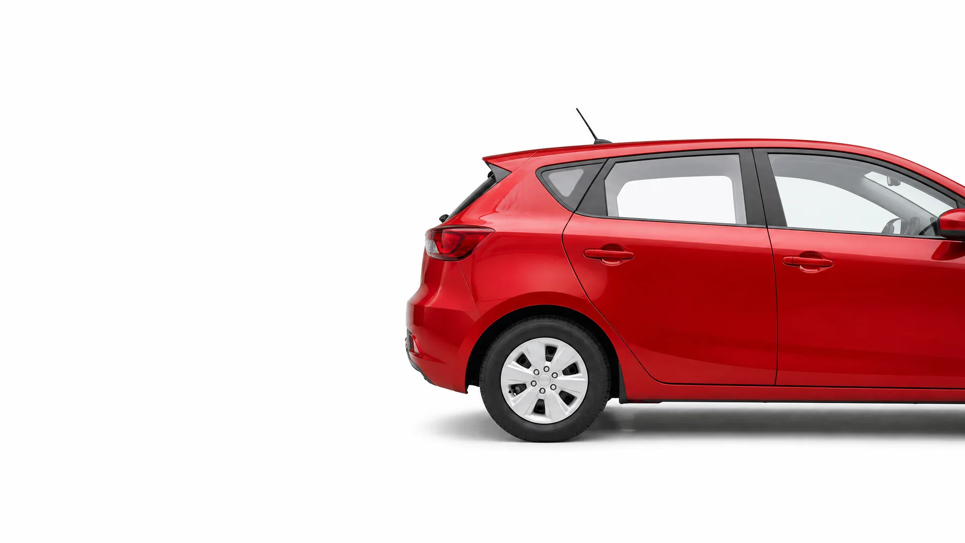Rear half of a red five-door hatchback car shown in side profile against a plain white background.