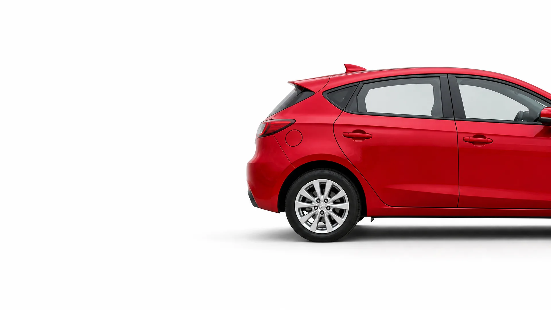 Rear half of a red five-door hatchback car shown in side profile against a plain white background with a soft shadow beneath.