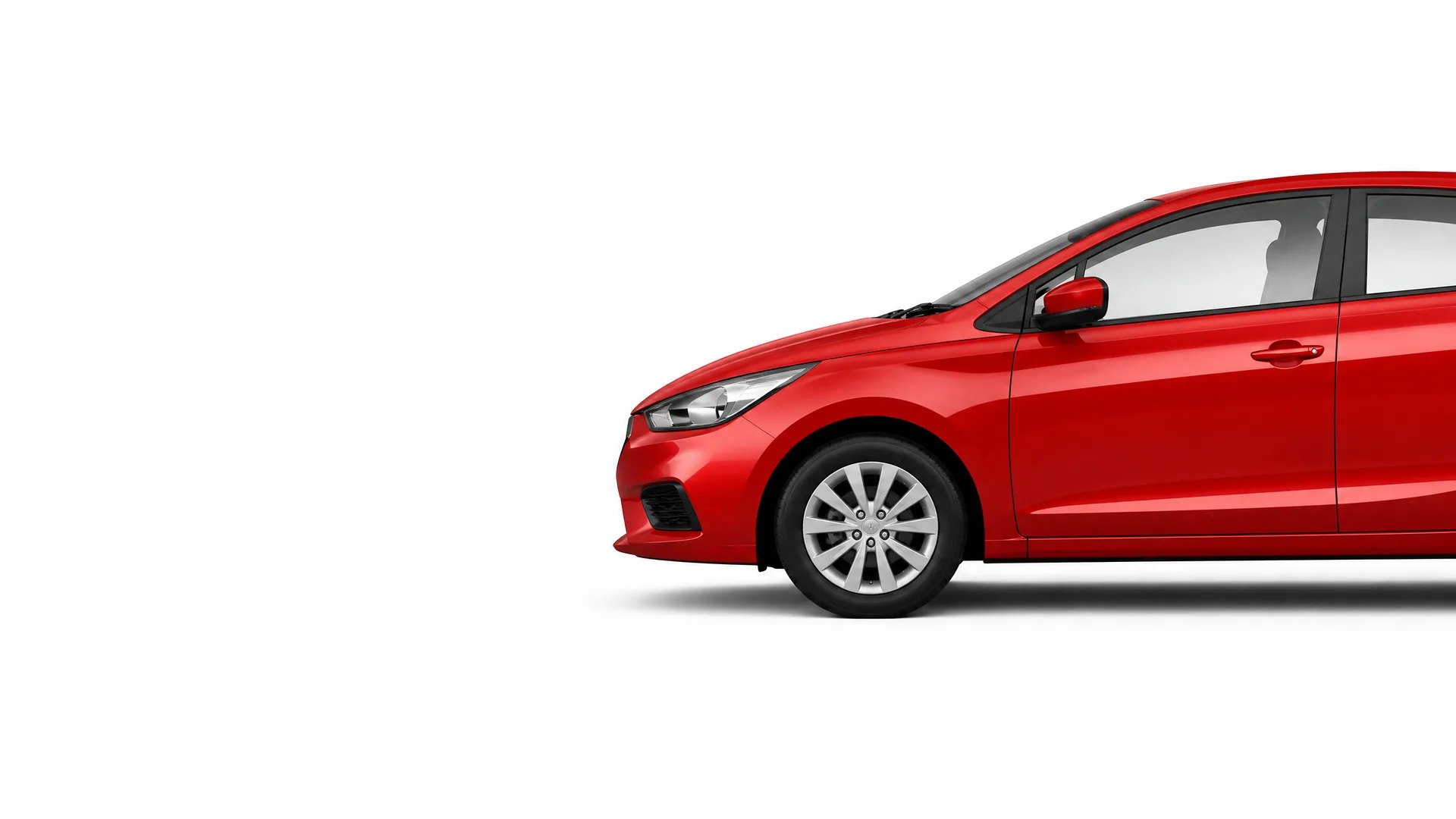 Front half of a red four-door car shown in side profile against a plain white background.