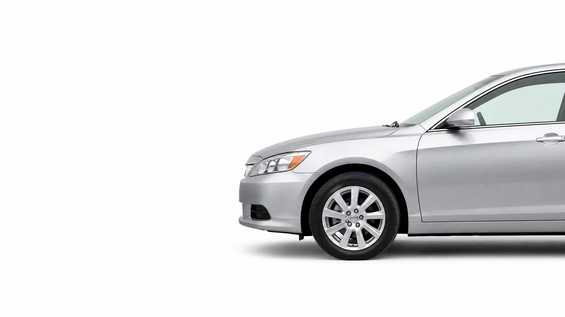 Front half of a silver four-door sedan, shown in profile against a plain white background.