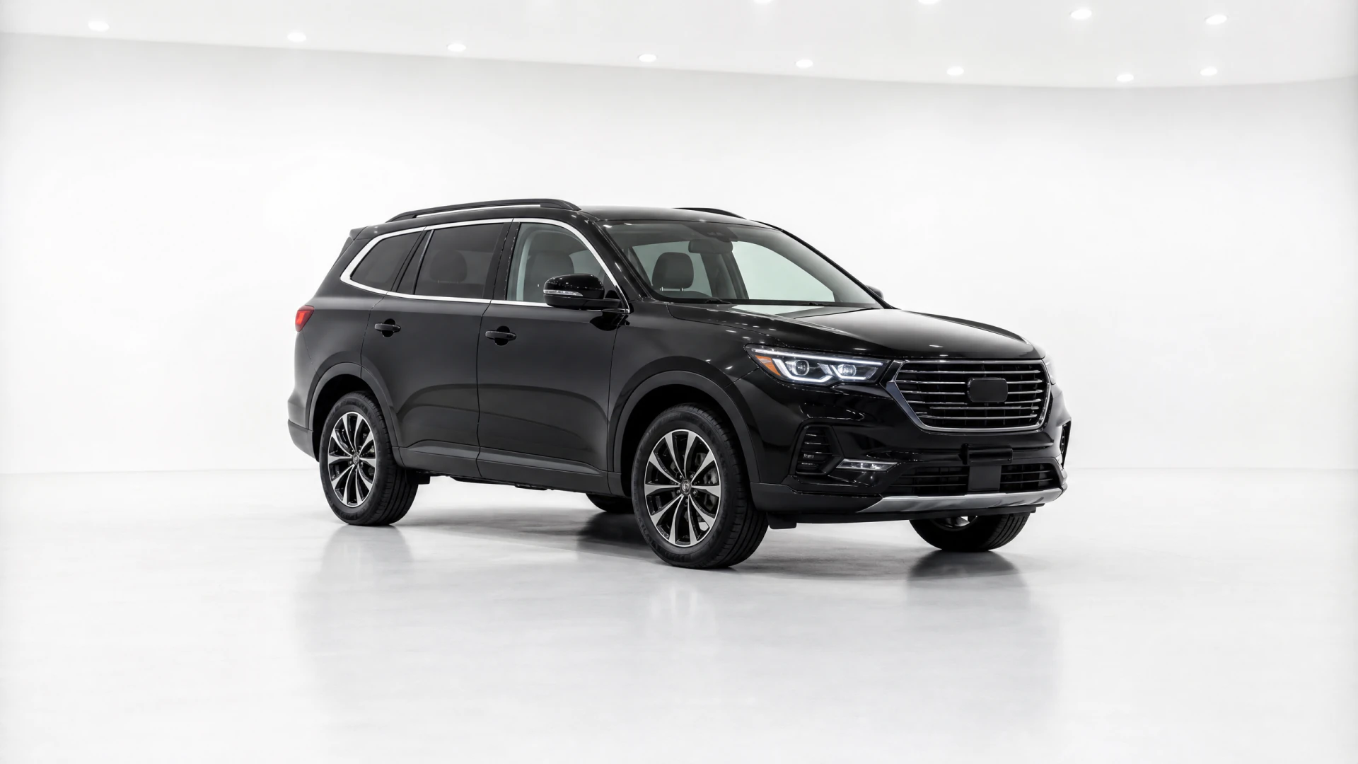 A glossy black three-row SUV displayed in a white photography studio.