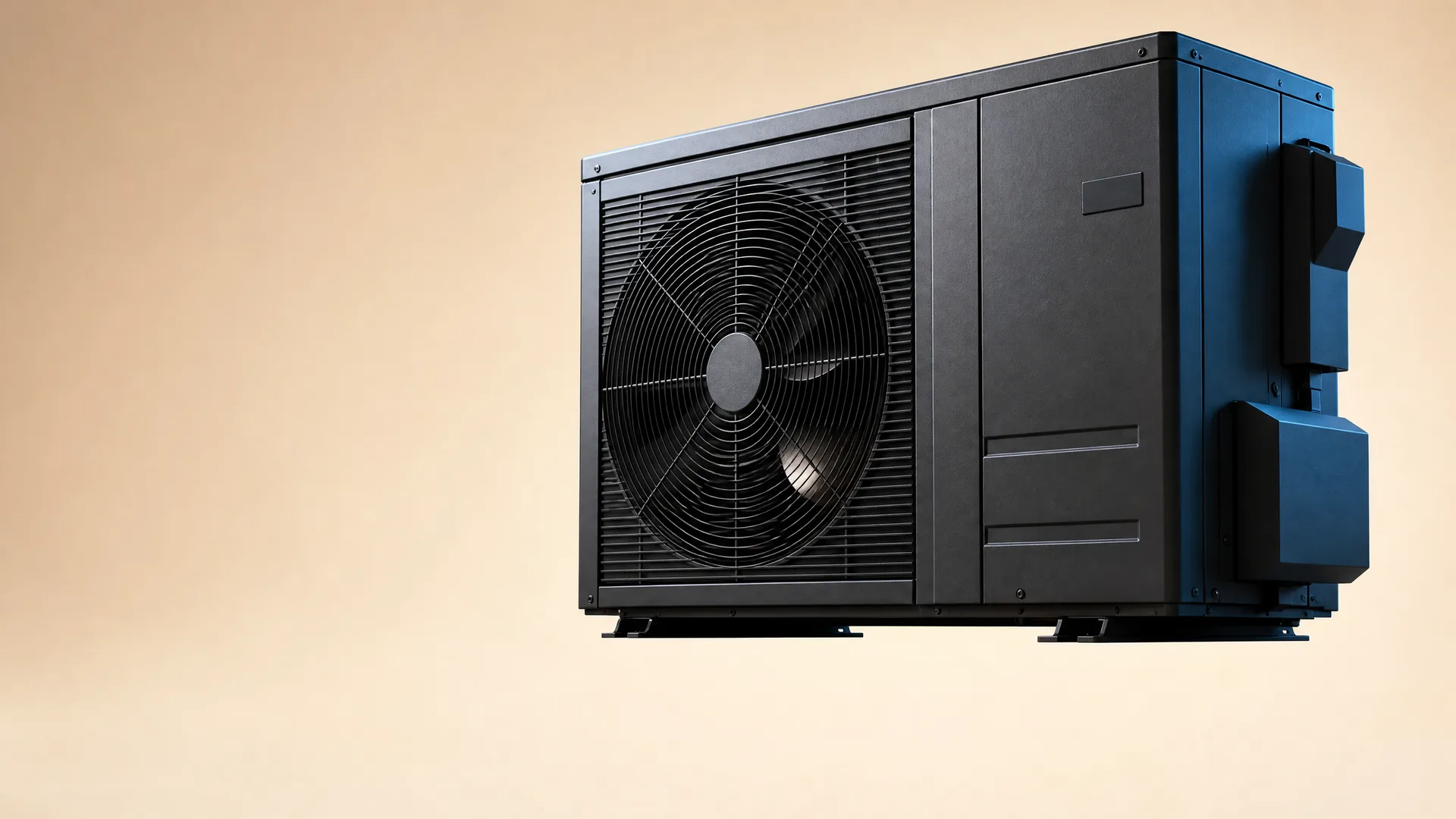 A dark grey and blue air-source heat pump unit with a large circular fan and louvered grille, shown against a plain beige background.