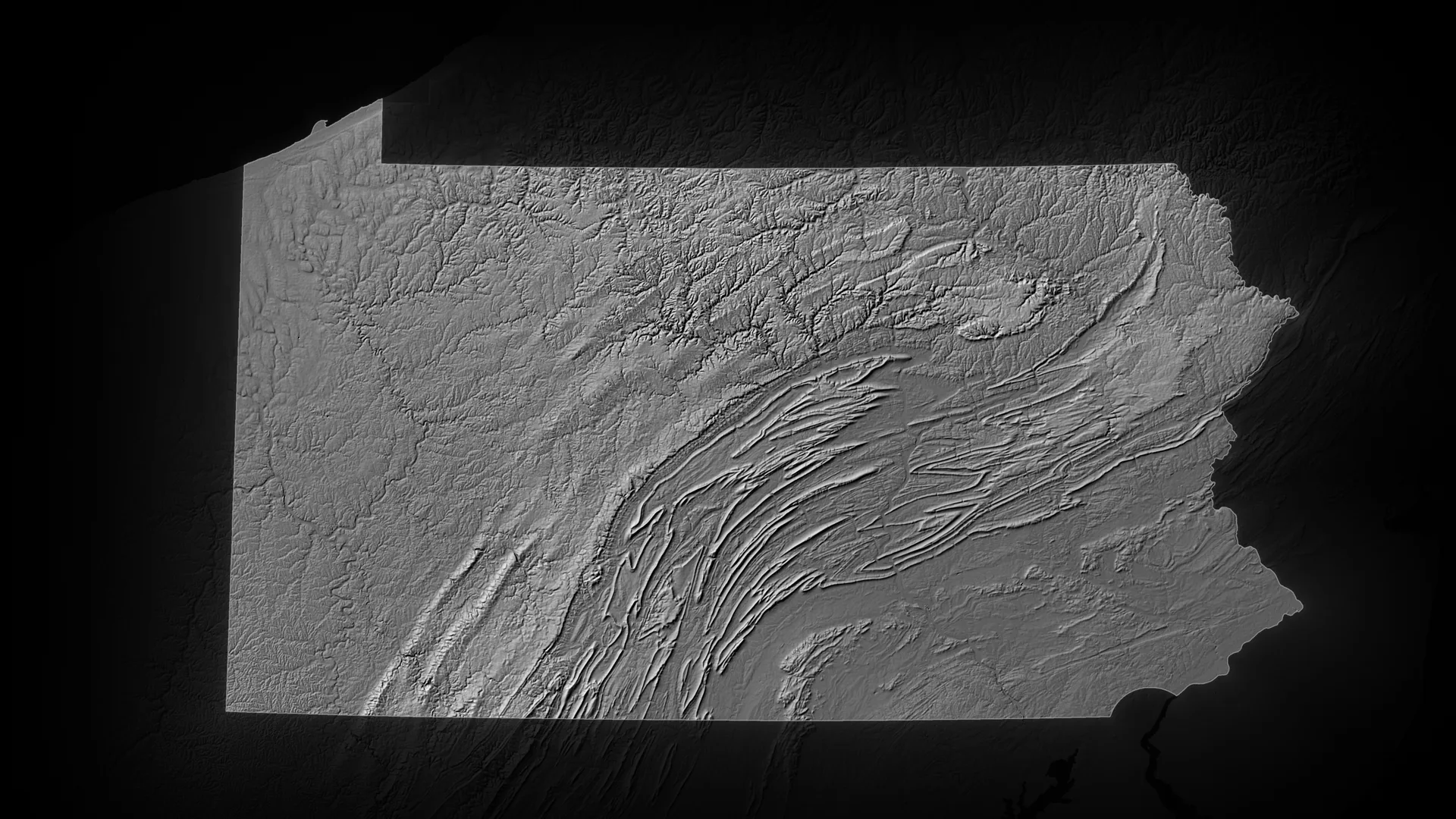 Relief map of Pennsylvania, its terrain lit, the neighbouring states fading into the dark