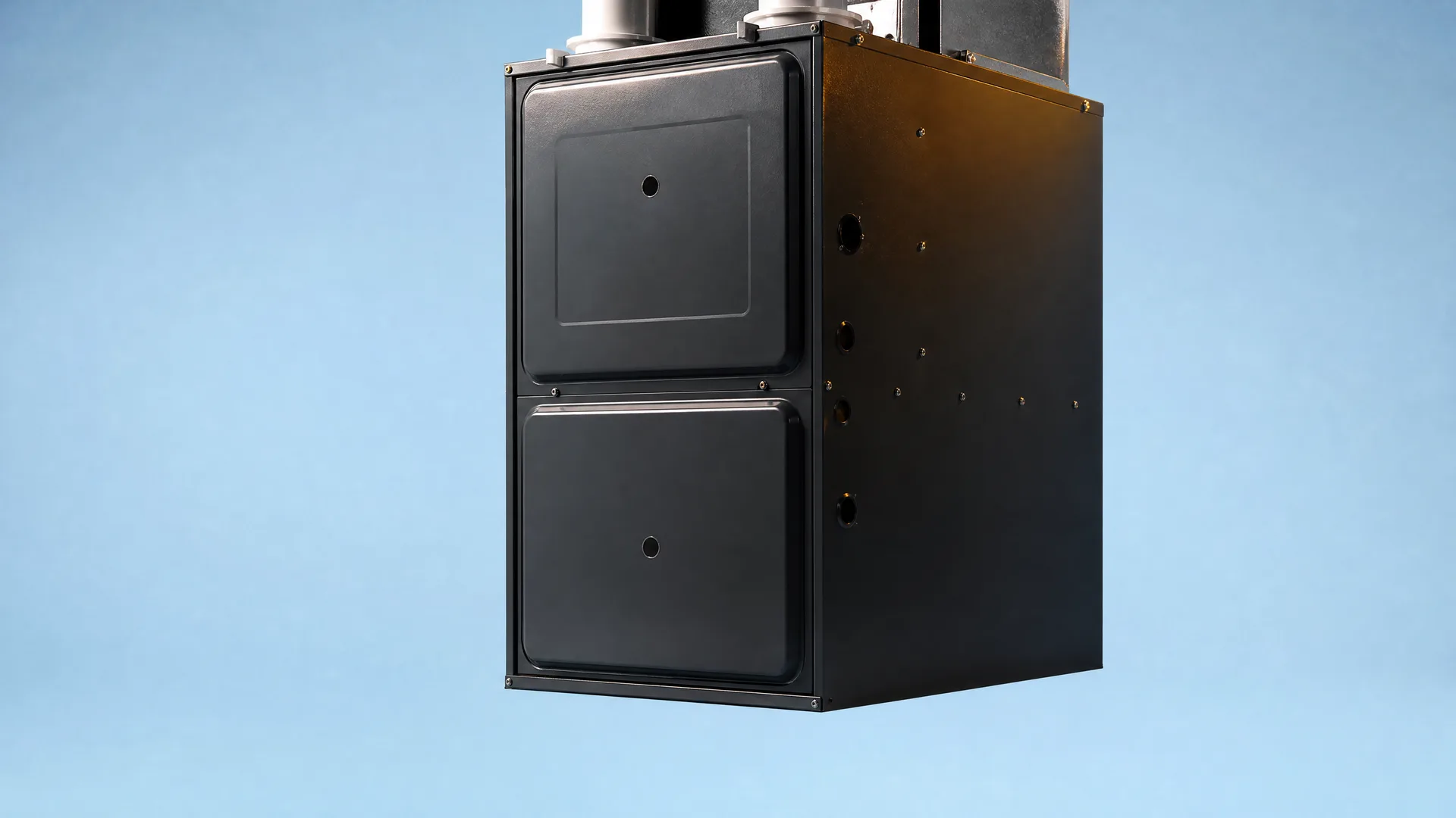 A black two-panel furnace cabinet with metal pipes on top, shown against a plain light blue background.